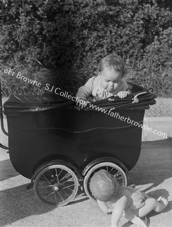 BABY IN PRAM WITH DOLL